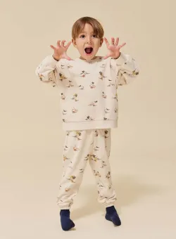 Konges Sløjd pantaloni de trening din bumbac pentru copii culoarea bej, cu imprimeu